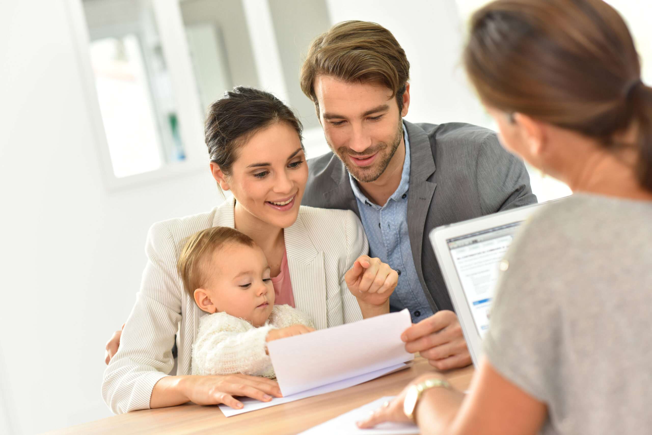 A young family is meeting with a Vero Beach lawyer who handles estate planning. It is never too early to begin.