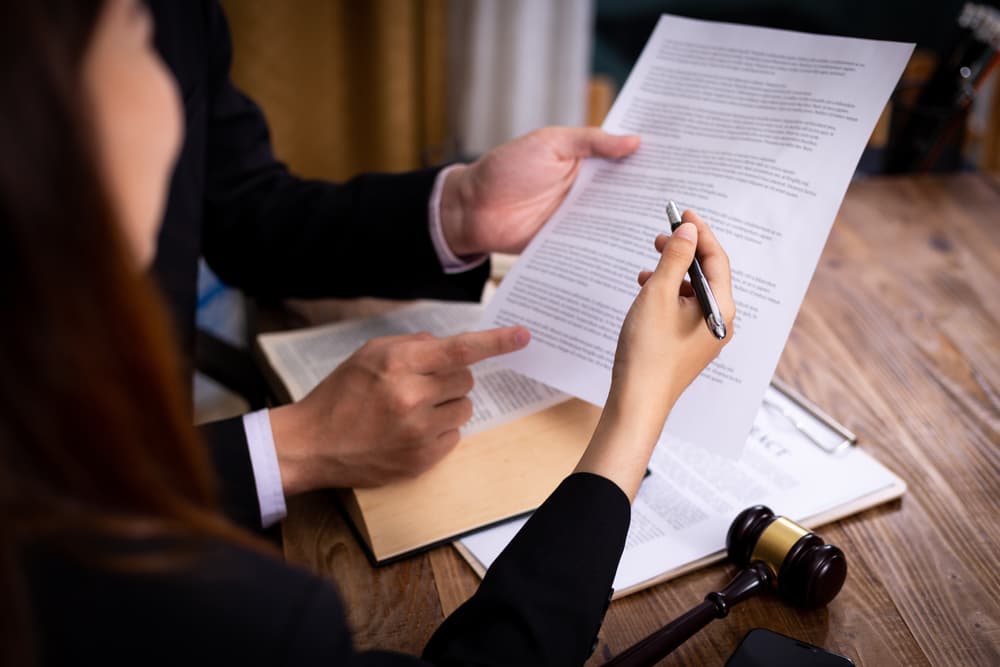 Client and an attorney reading the Real Estate Contract