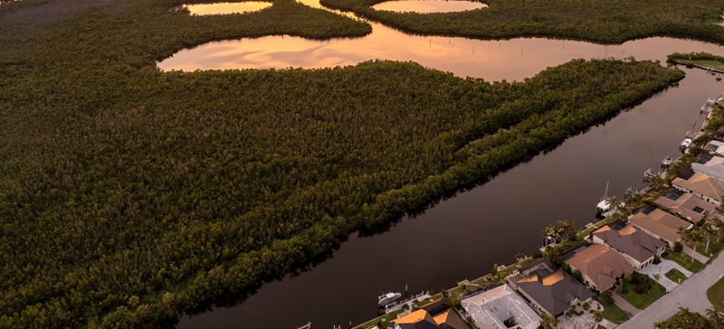 Waterfront property in Florida at sunset.